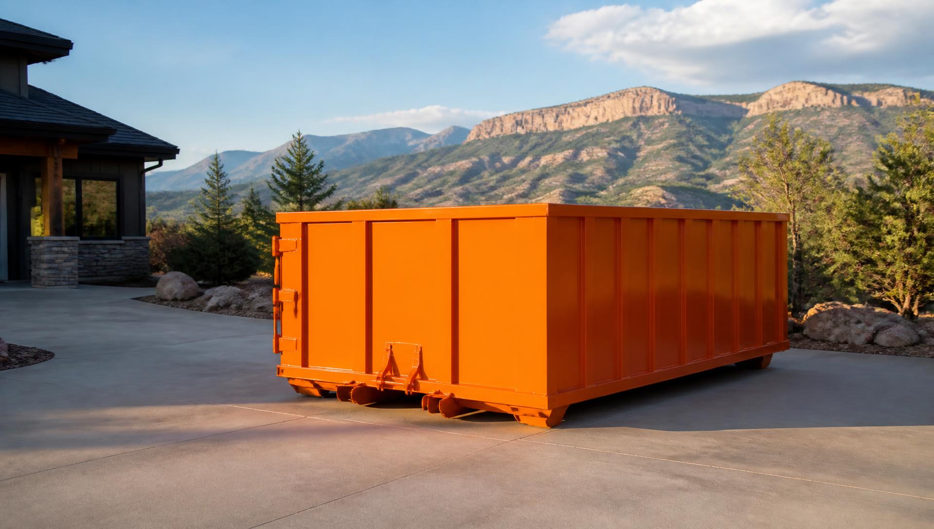 Roll-off dumpster staged on a residential driveway